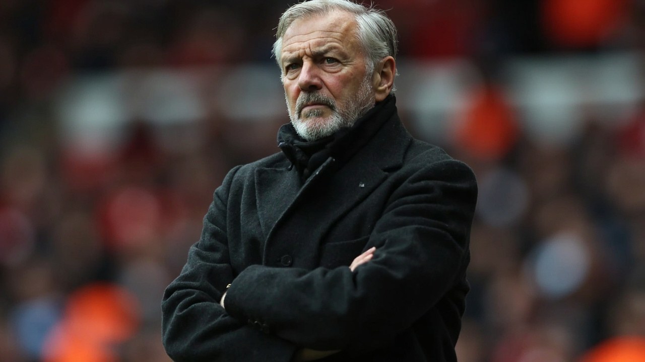 Roberto De Zerbi standing on the touchline at Anfield in a dark coat with his arms folded, the Liverpool main stand blurred in the background under grey October daylight